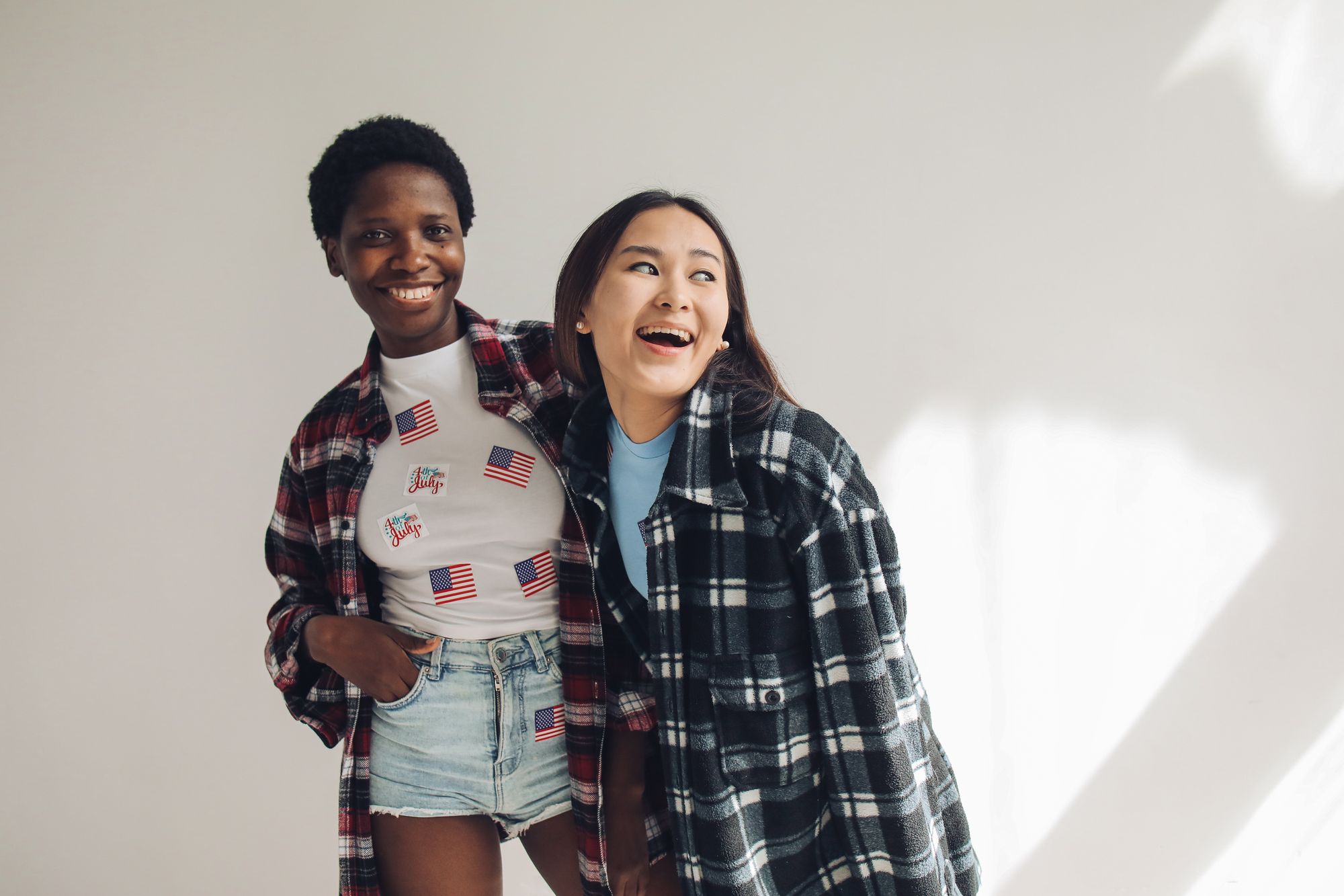 Friends in patriotic Flagzz tees celebrating outdoors