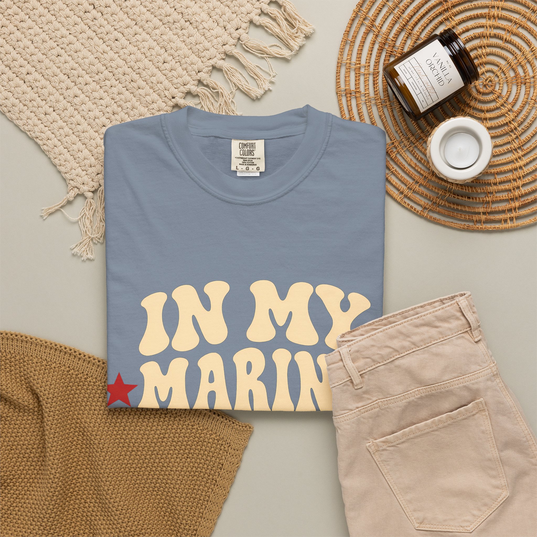 In My Marine Sister Era Comfort Colors Tee in Blue Jean, folded
