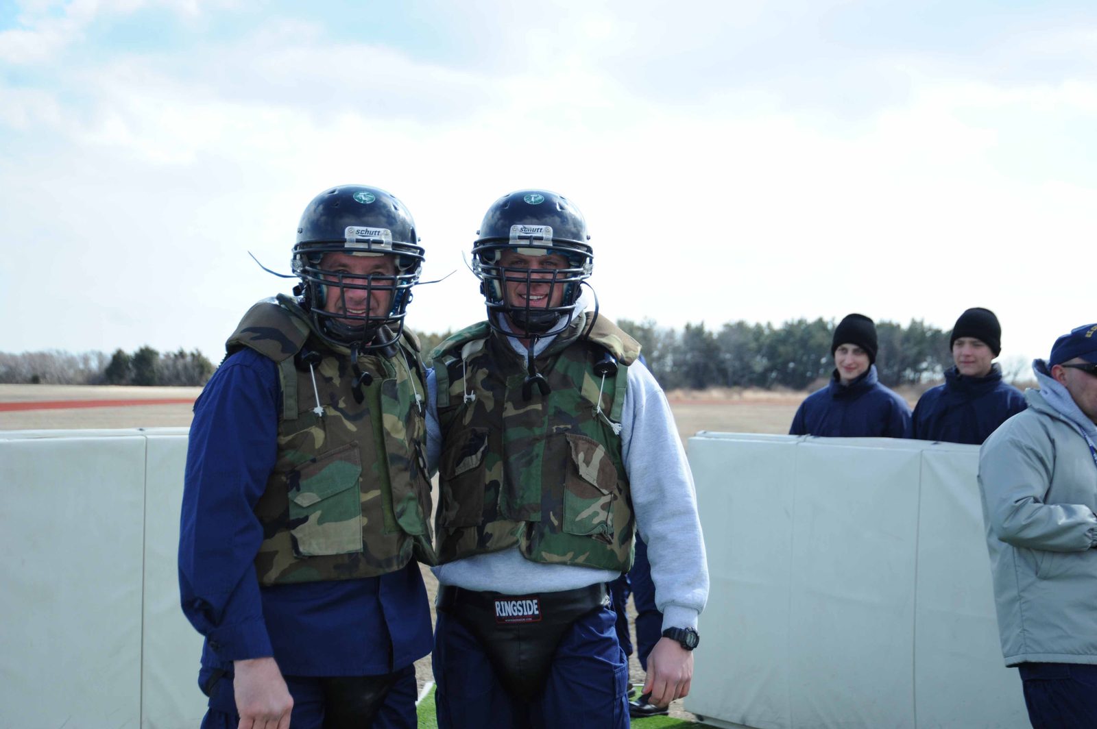 Coast Guard recruits in helmets and protective gear during training at Cape May