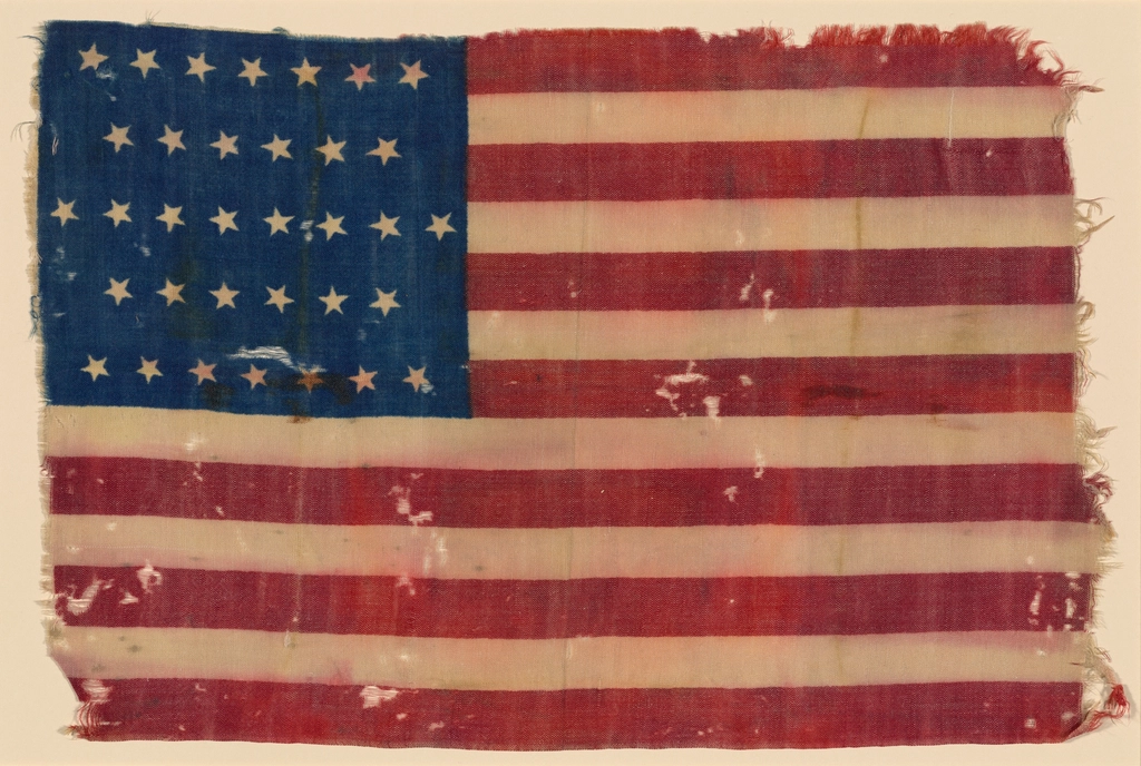 A faded 34 star American flag from around 1862 with hand stitched stars