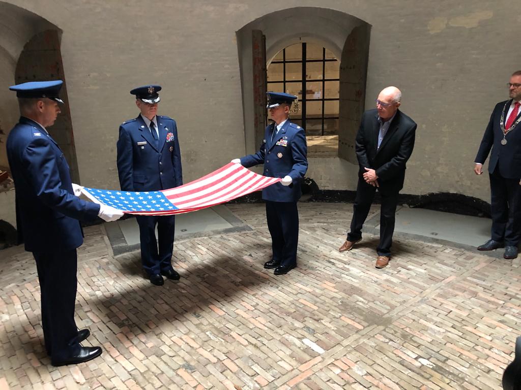 An honor guard folding the United States flag into a triangle