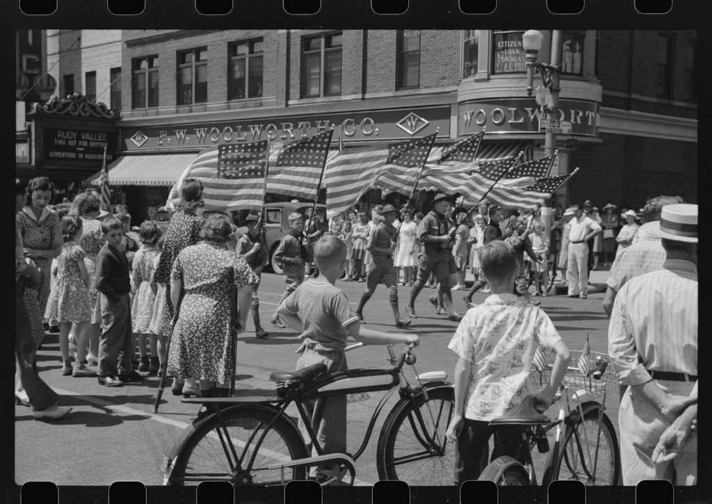 A Fourth of July parade in Watertown, Wisconsin, with flags lining the street